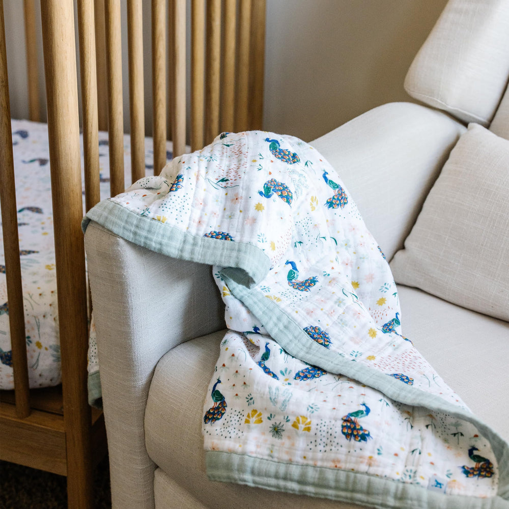 Little Unicorn soft-foldable quilt folds compactly for easy packing.