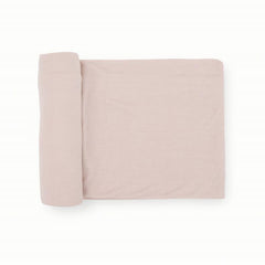 Little Unicorn soft-blush swaddle blanket close-up shows buttery softness for cozy cuddles.