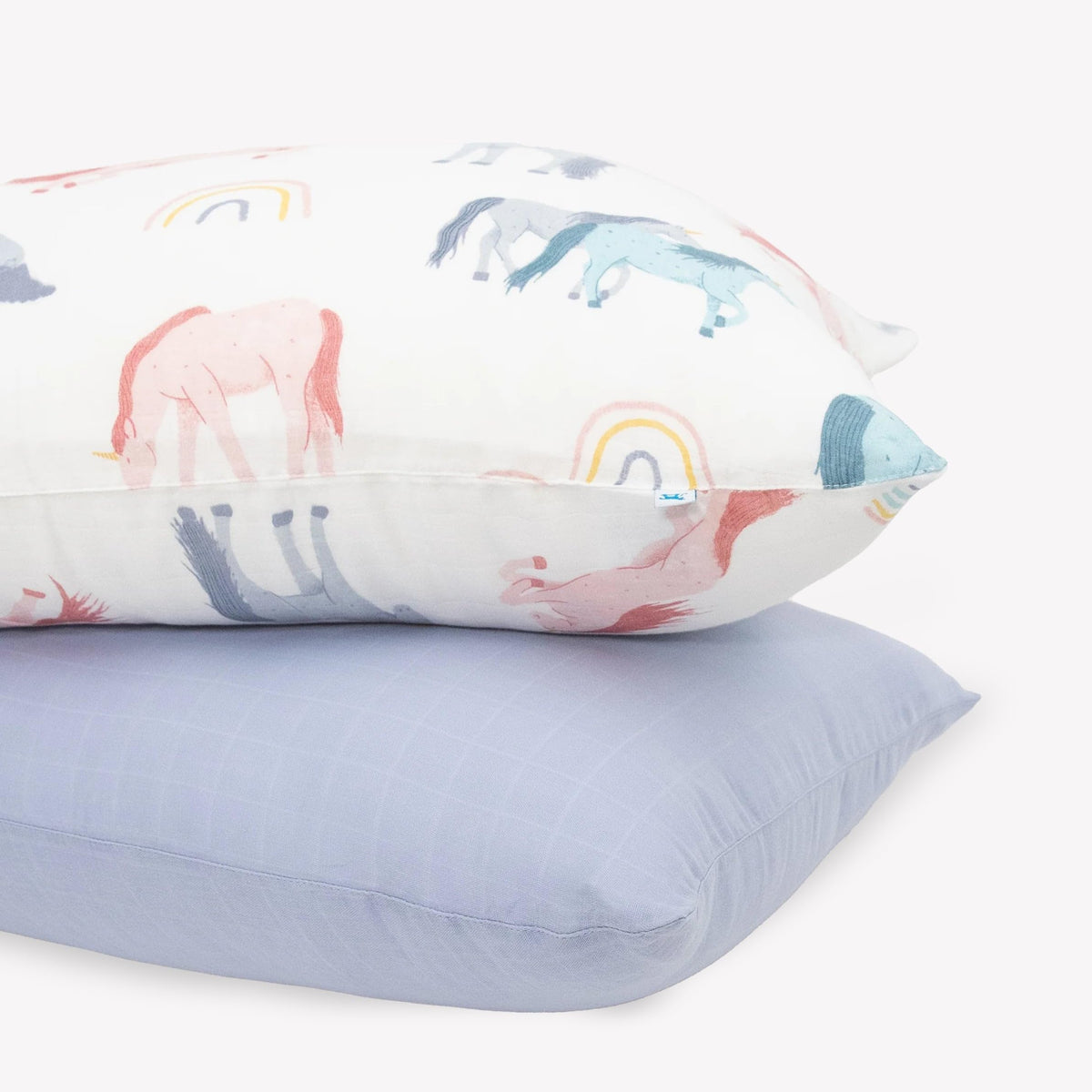 Little Unicorn standard pillowcase 2-pack shows plush muslin texture for a soft sleep experience.