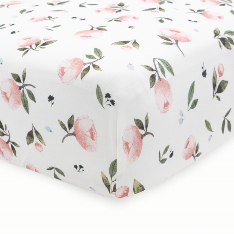 Little Unicorn crib sheet fits snugly on standard mattress for peaceful nights.
