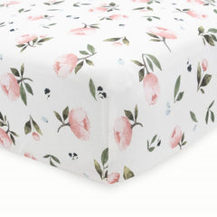 Little Unicorn crib sheet fits snugly on standard mattress for peaceful nights.