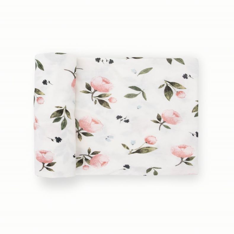Little Unicorn stretch knit swaddle blanket in watercolor rose shows gentle stretch for secure wrapping.