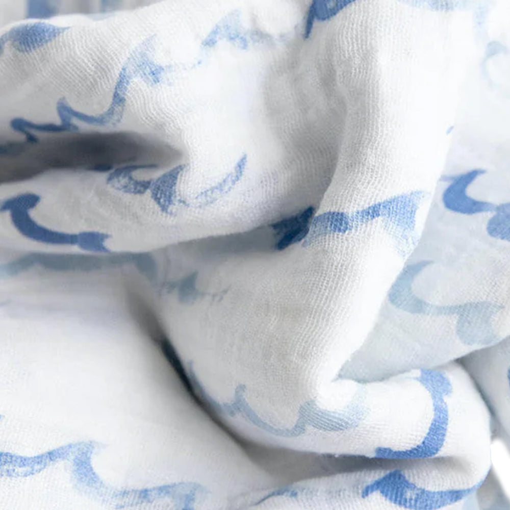 Little Unicorn stroller cover swaddle highlights on-the-go versatility for outside time.