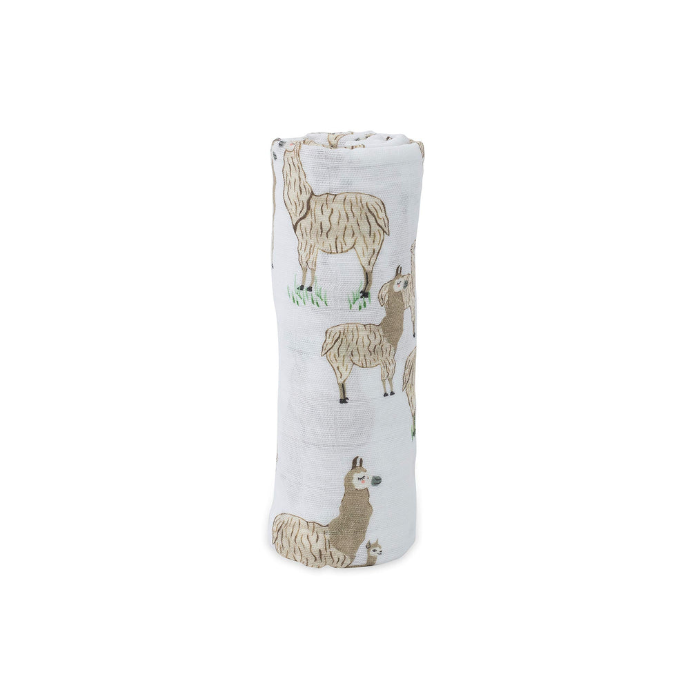 Little Unicorn llama design swaddle used as a stroller cover for on-the-go comfort.