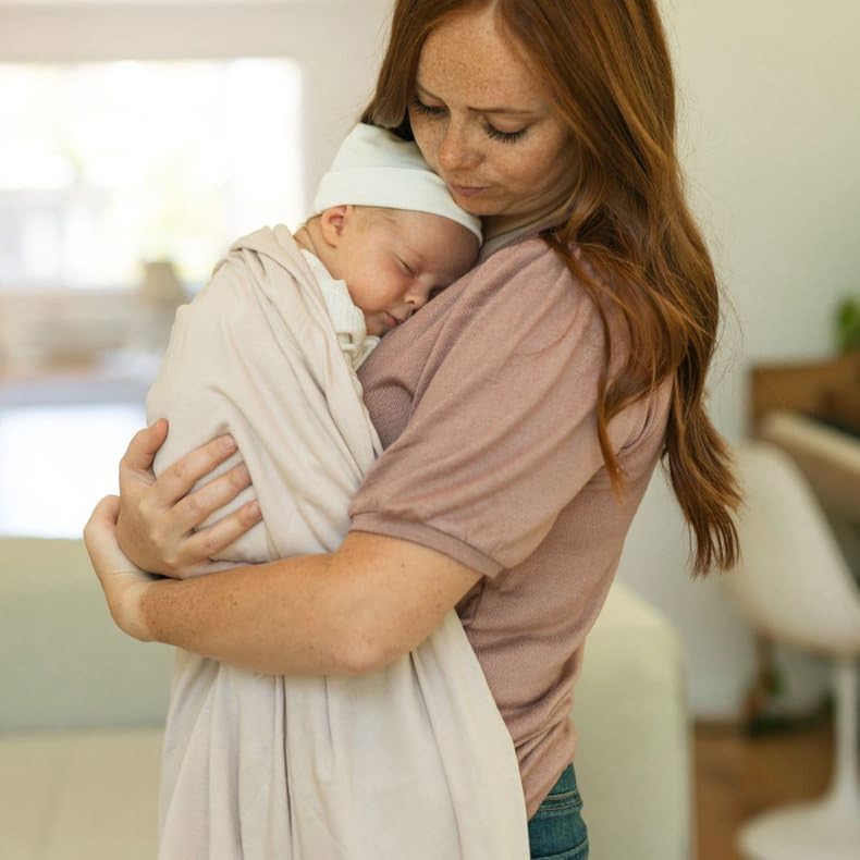 Little Unicorn swaddle in stroller for on-the-go comfort.
