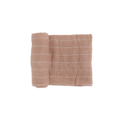 Little Unicorn Mauve Stripe swaddle closeup shows soft cotton muslin for newborn comfort.