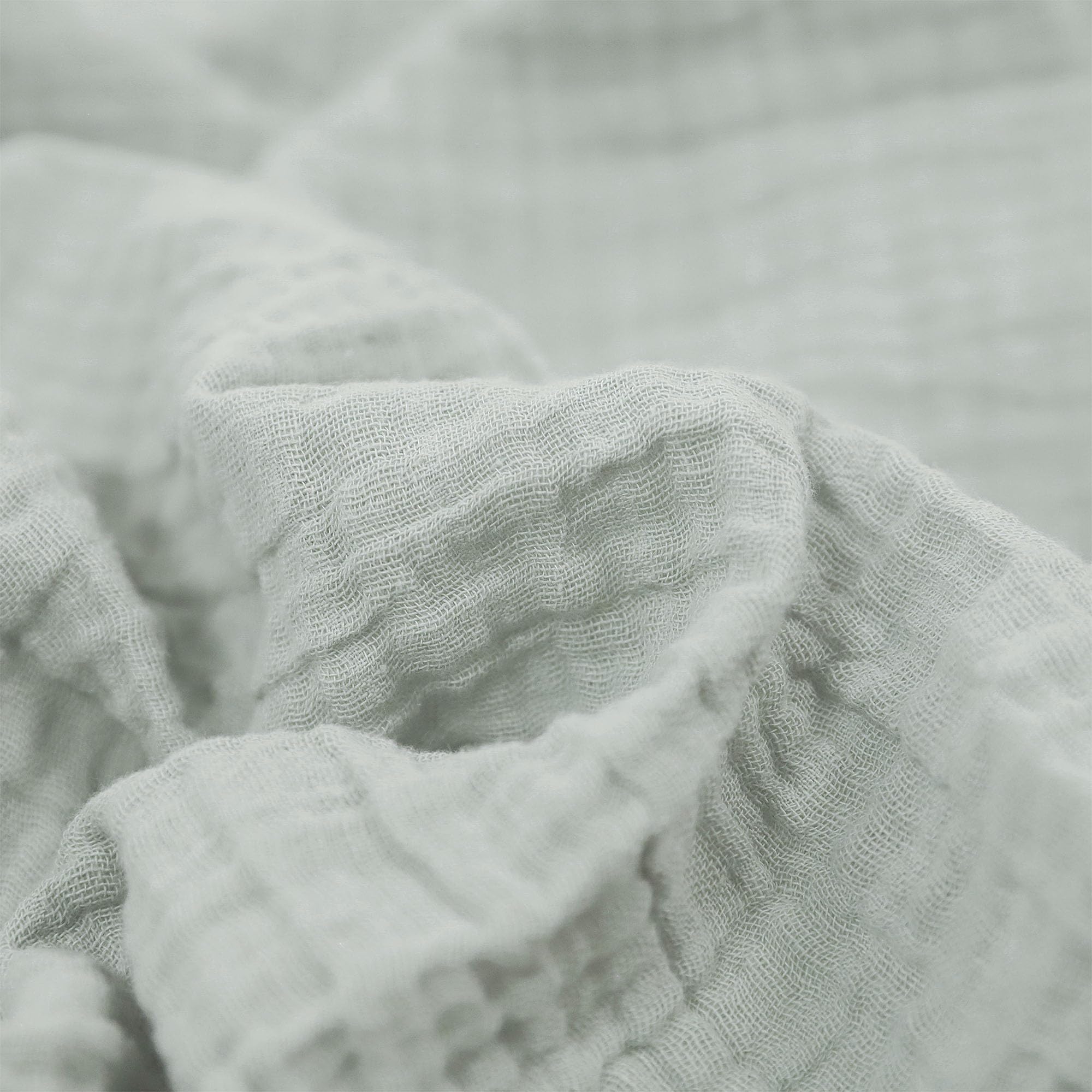 Little Unicorn muslin swaddle with pencil floral pattern for gentle wrapping
