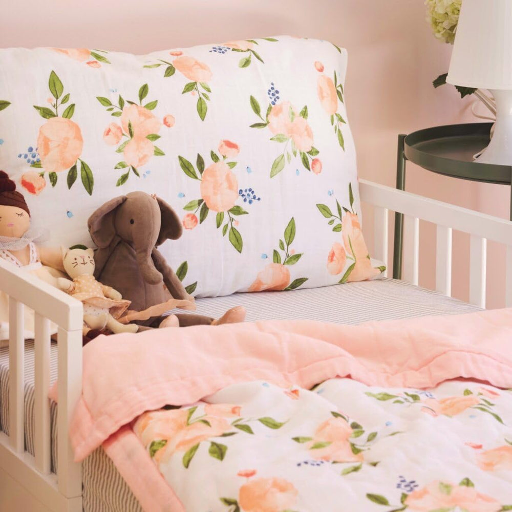 Little Unicorn Toddler bed crib fit demonstrates a snug conversion-ready blanket