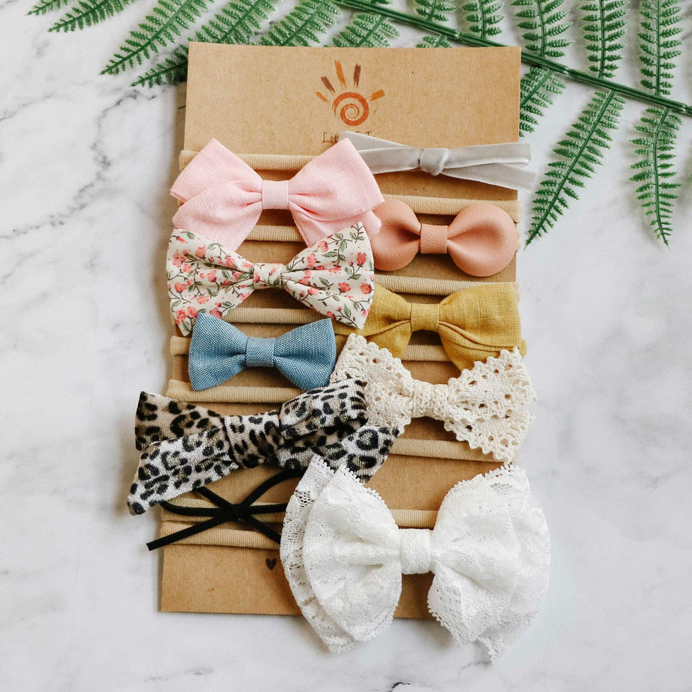 LittleJoJo leather bow on light fabric for chic everyday looks