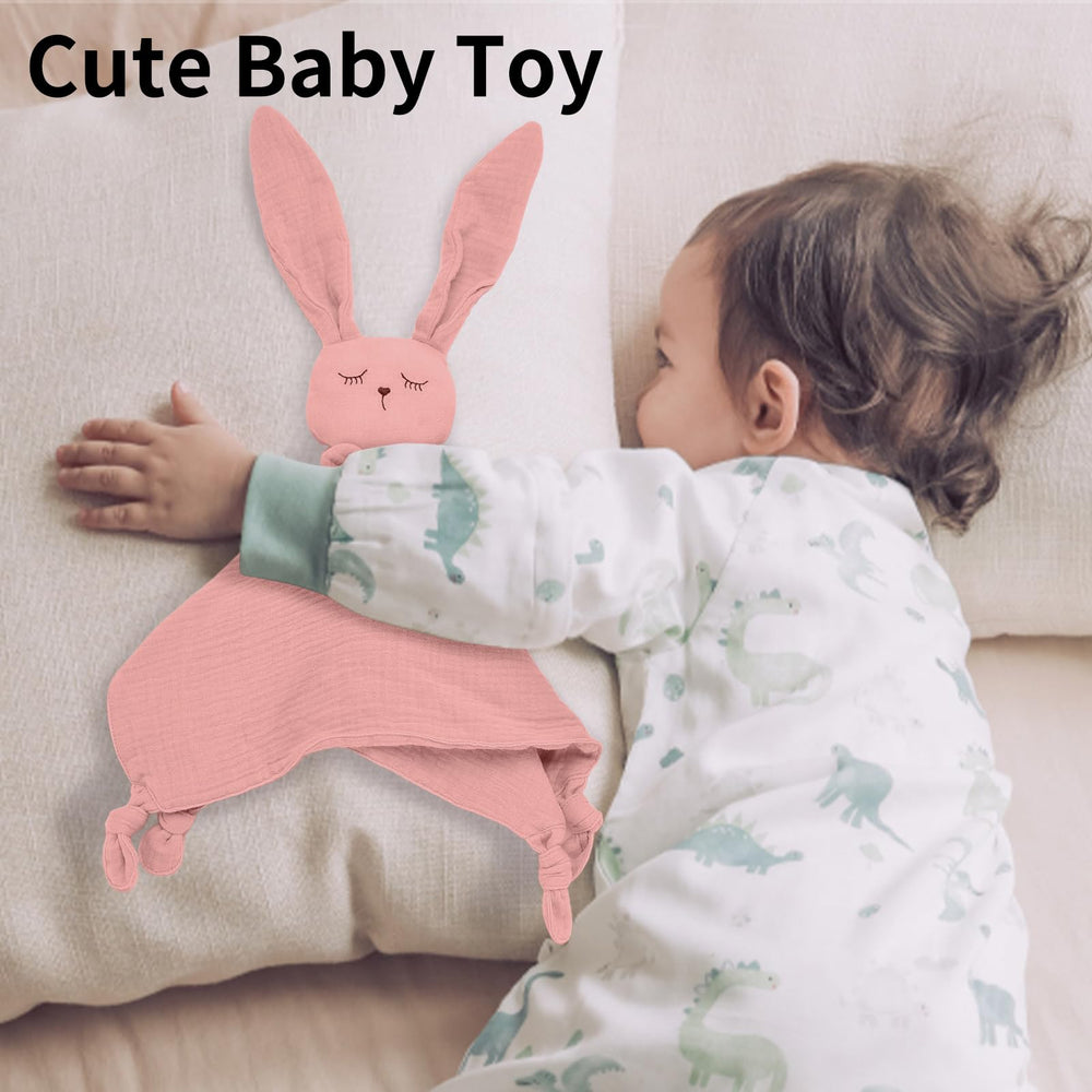Little Rawr Bunny Lovey being hugged by a baby for comforting support.