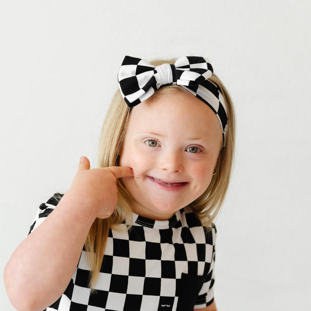 Little Sleepies Luxe Bow Headband Checks shown in packaging for gifting or registry adds appeal