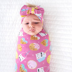 Little Sleepies swaddle used as stroller shade on a sunny day.
