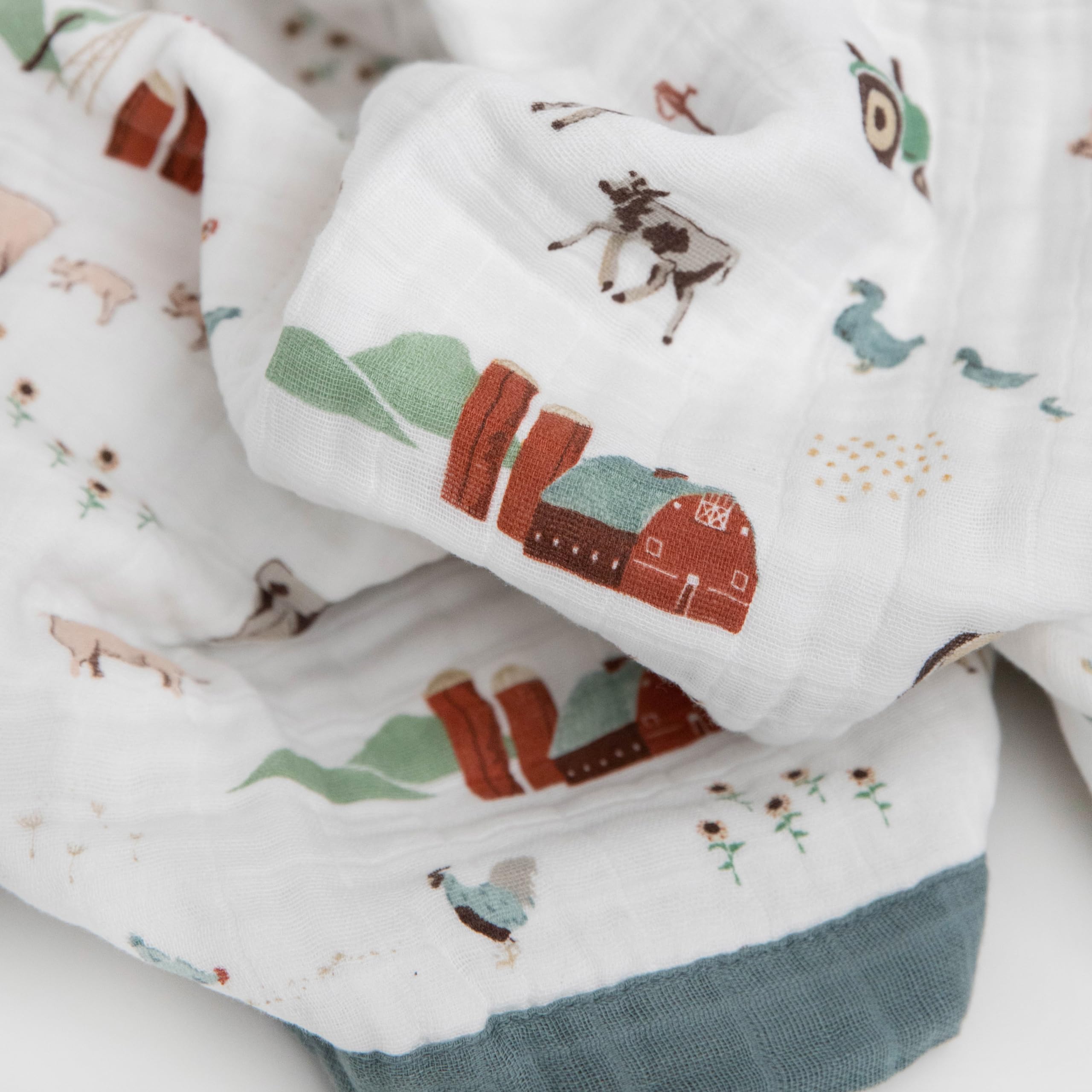 Edge binding on Little Unicorn farmyard quilt for long-lasting wear during washes