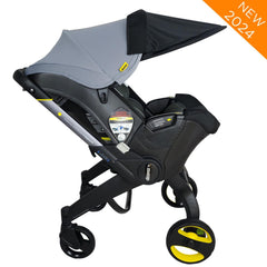 Doona Sunshade Extension in use shows complete coverage while keeping baby visible and comfortable
