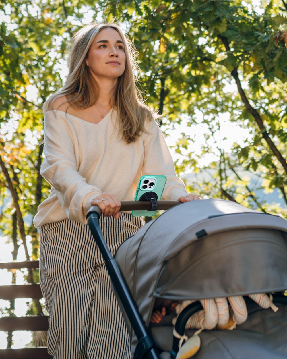 Liuliuby magnetic phone holder on a cart strap for hands-free shopping