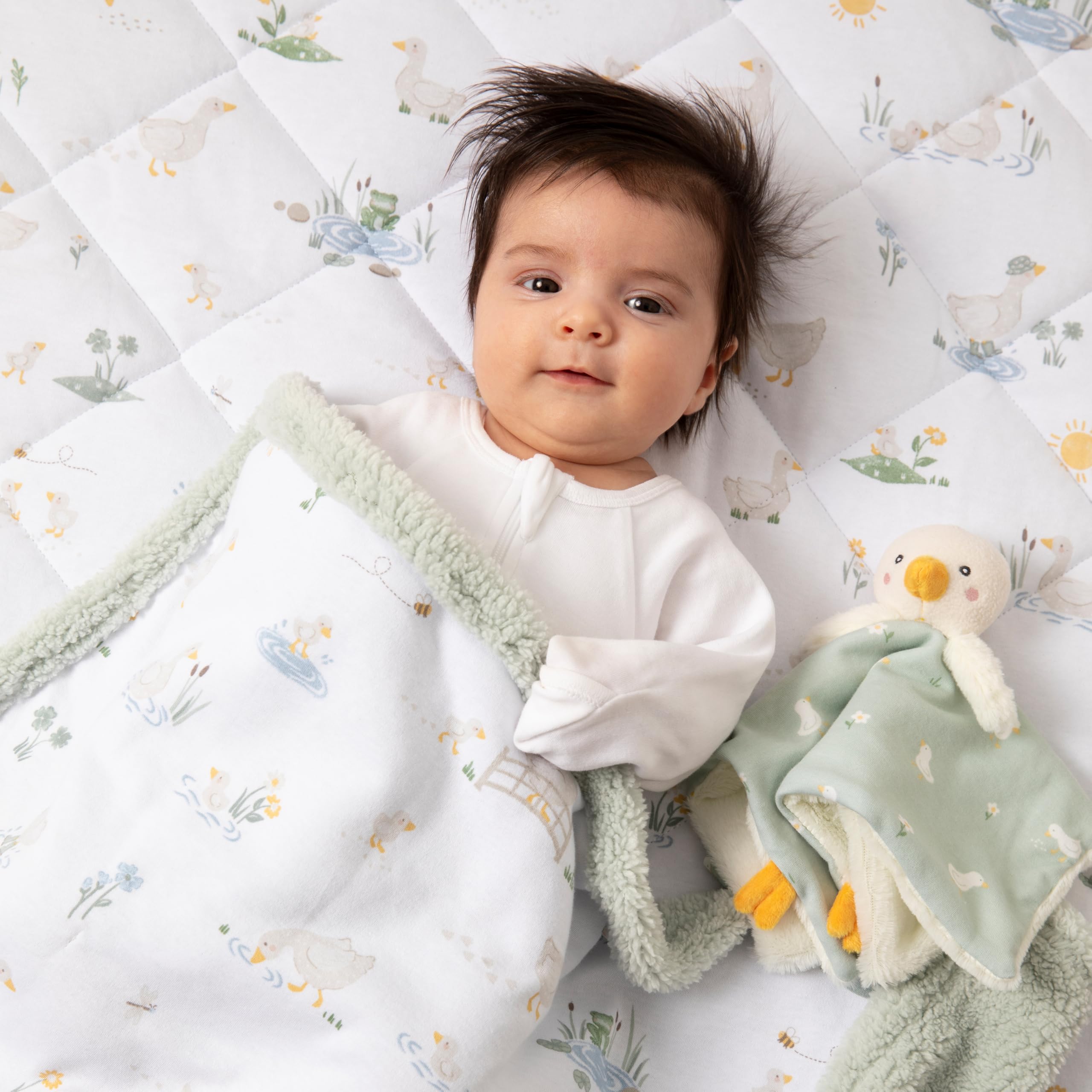 Living Textiles Goosey Goosey sherpa blanket in crib demonstrates nursery-ready comfort