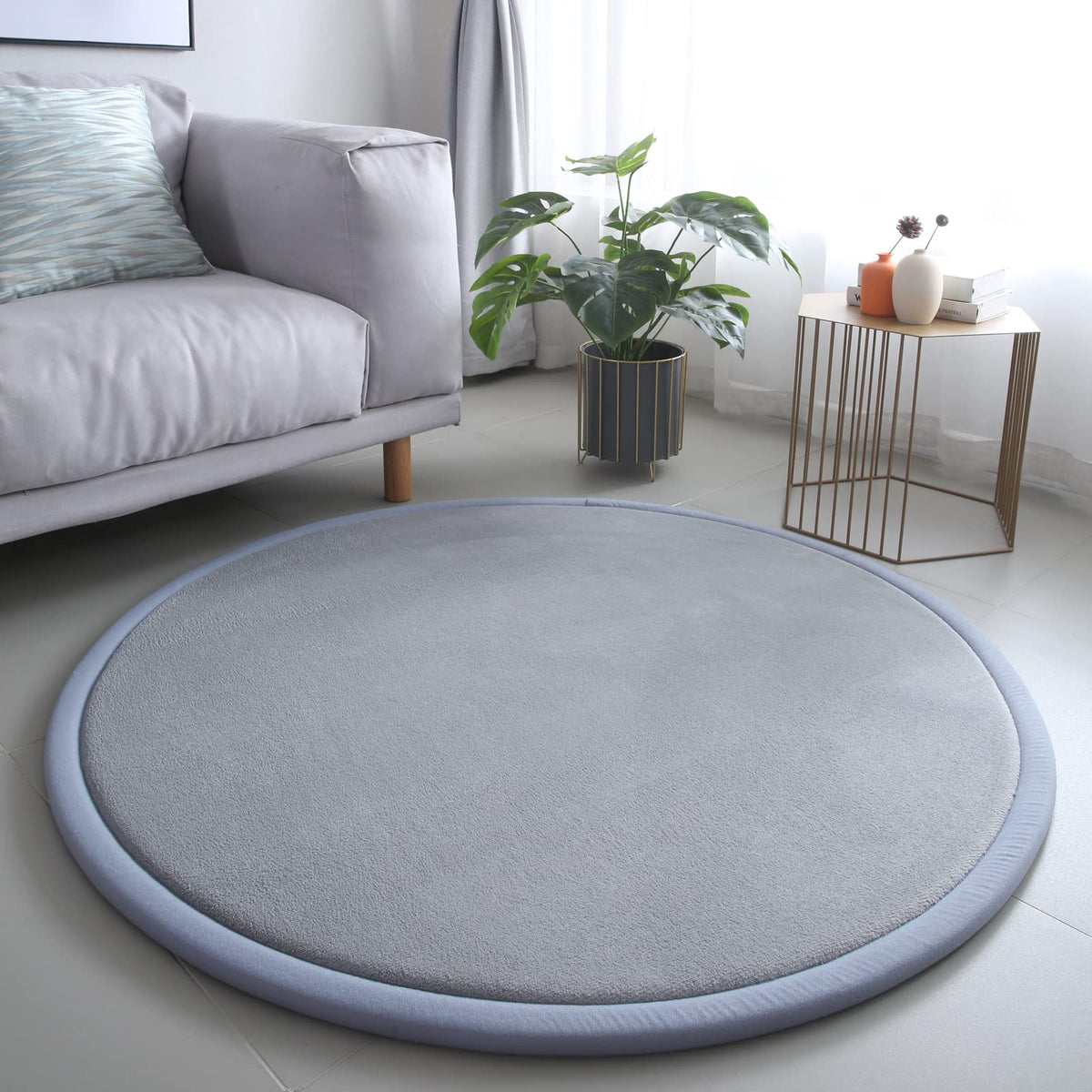 Loartee thick kids round rug in coral velvet, soft surface for nursery playtime.