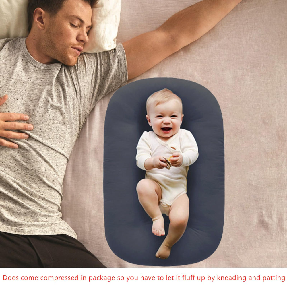 Loevin baby lounger guardrails provide gentle support during playtime.