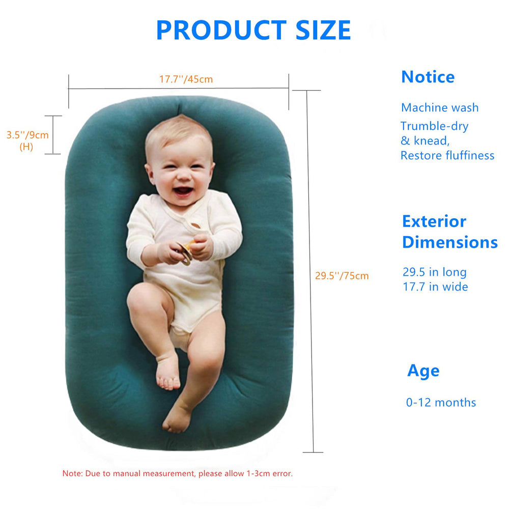 Loevin lounger placed on the floor for tummy time and play