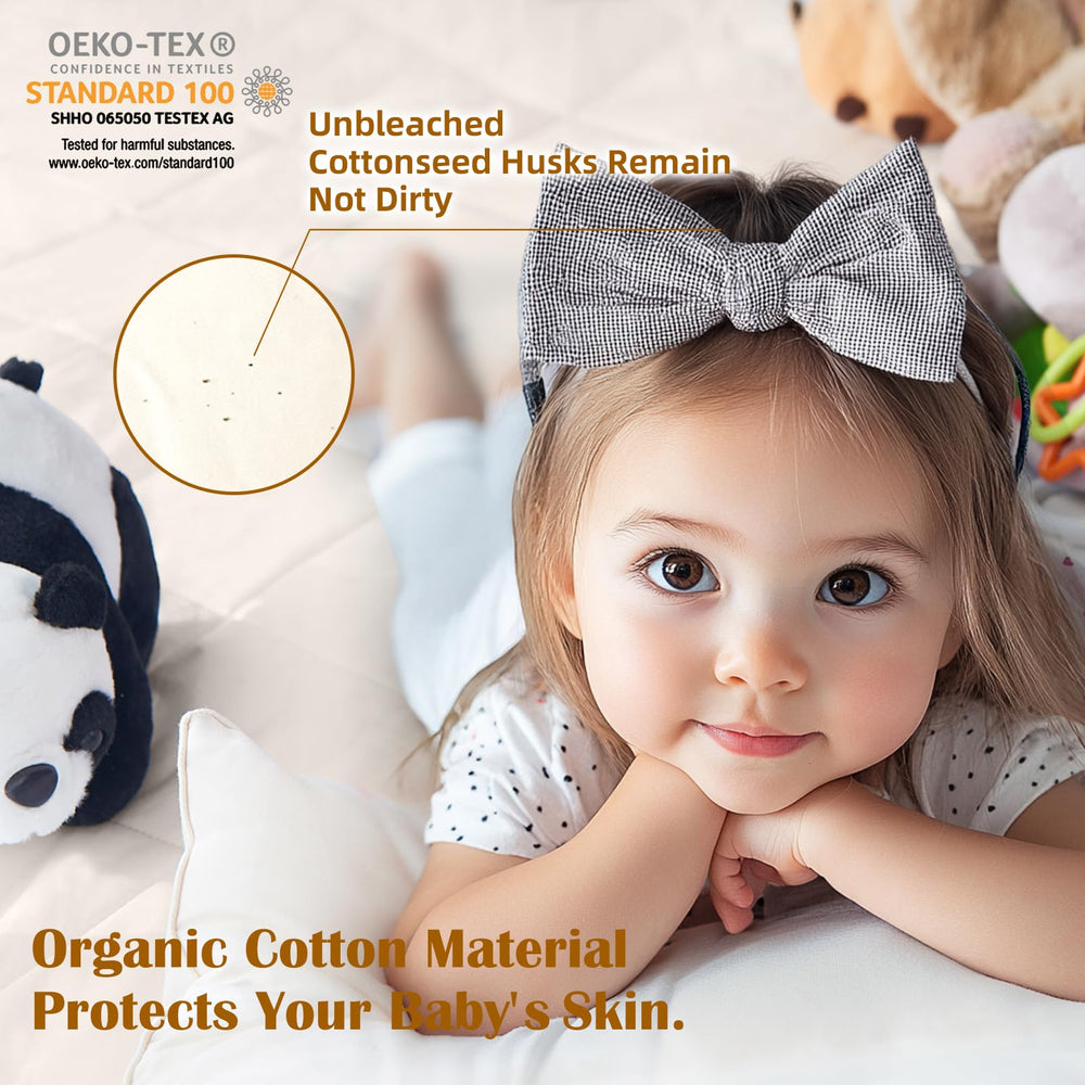 52x28x9 inch LOFE crib mattress protector on standard crib mattress.
