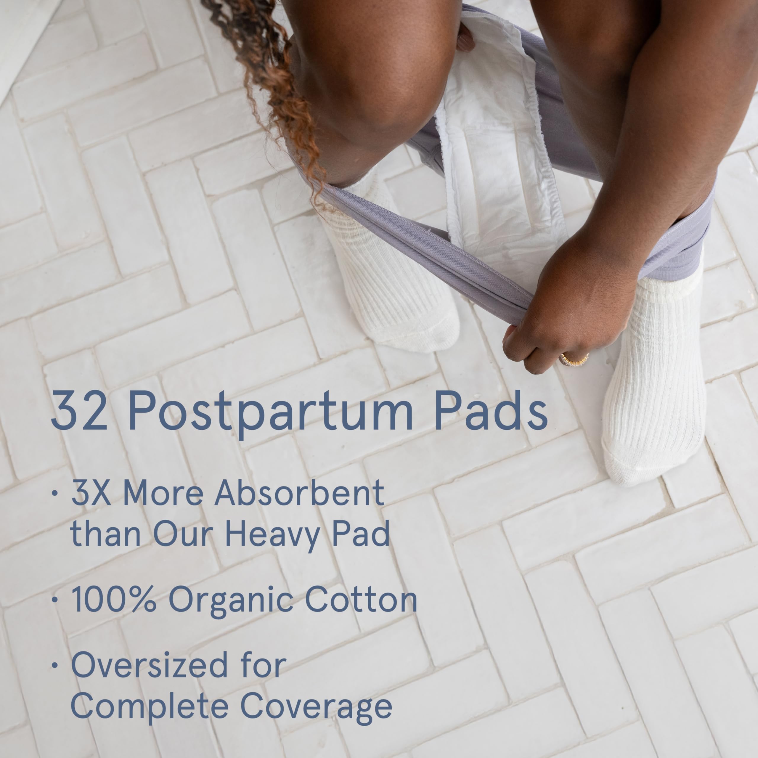 LOLA postpartum pad showing 14-inch length for extended coverage.