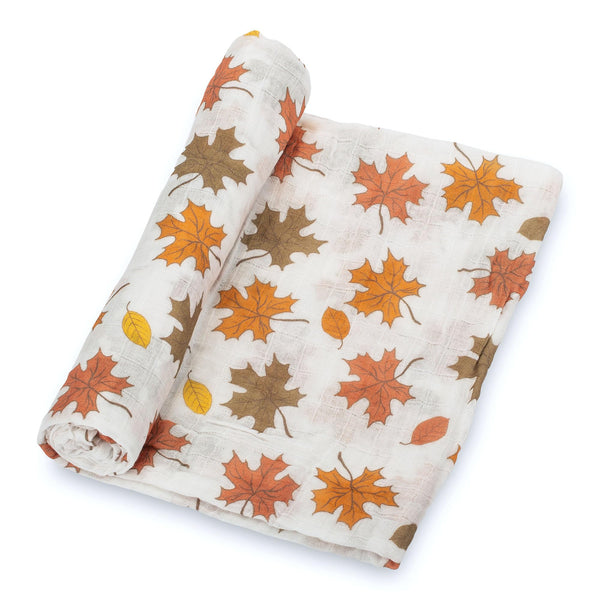LollyBanks autumn leaf swaddle closeup highlights soft cotton muslin texture for snug newborn comfort.