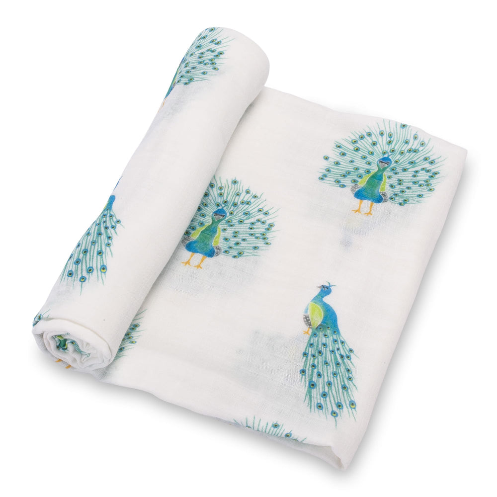 LollyBanks baby muslin swaddle with peacock print keeps baby cozy.