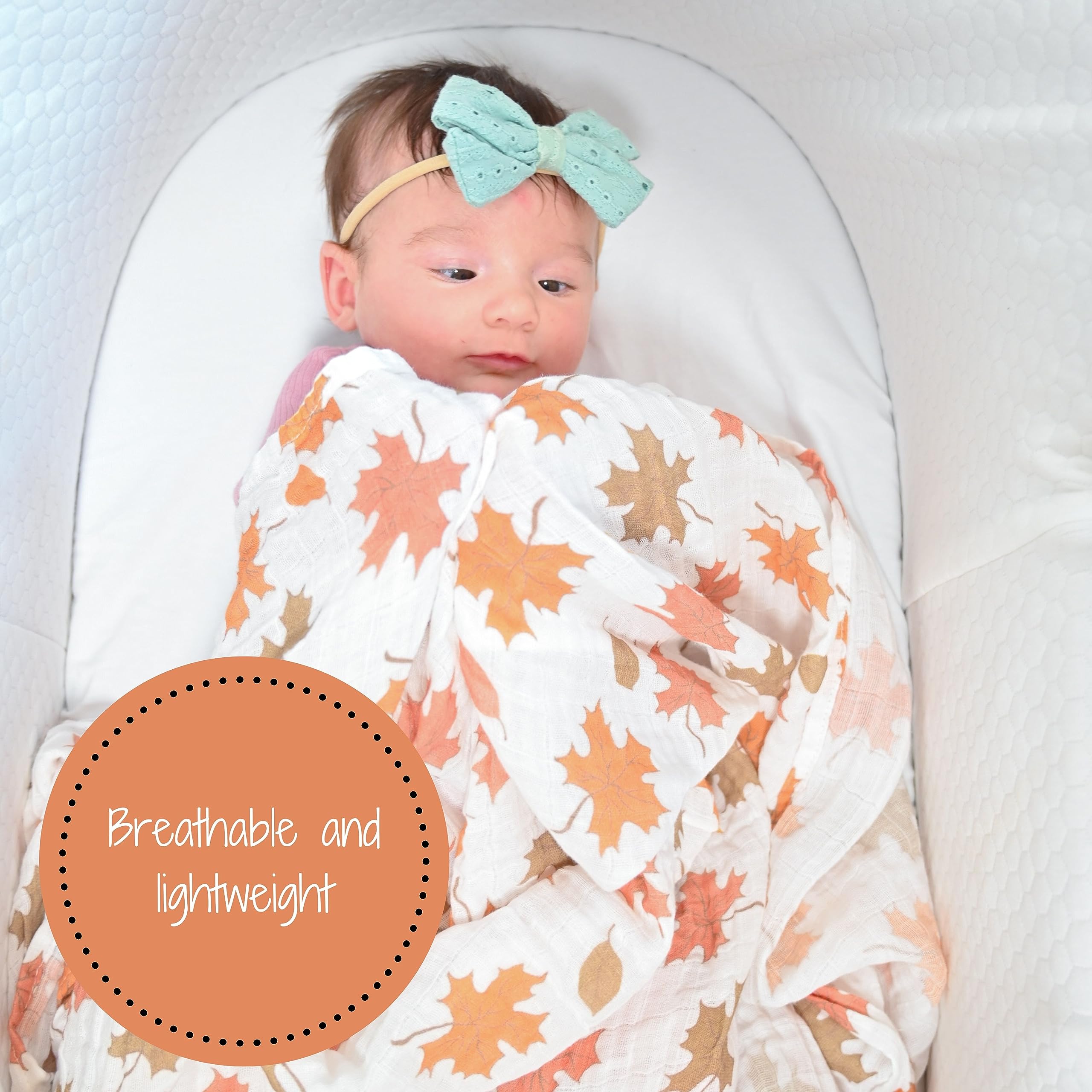 LollyBanks autumn leaf swaddle texture closeup emphasizes breathable 100% cotton for year-round use.