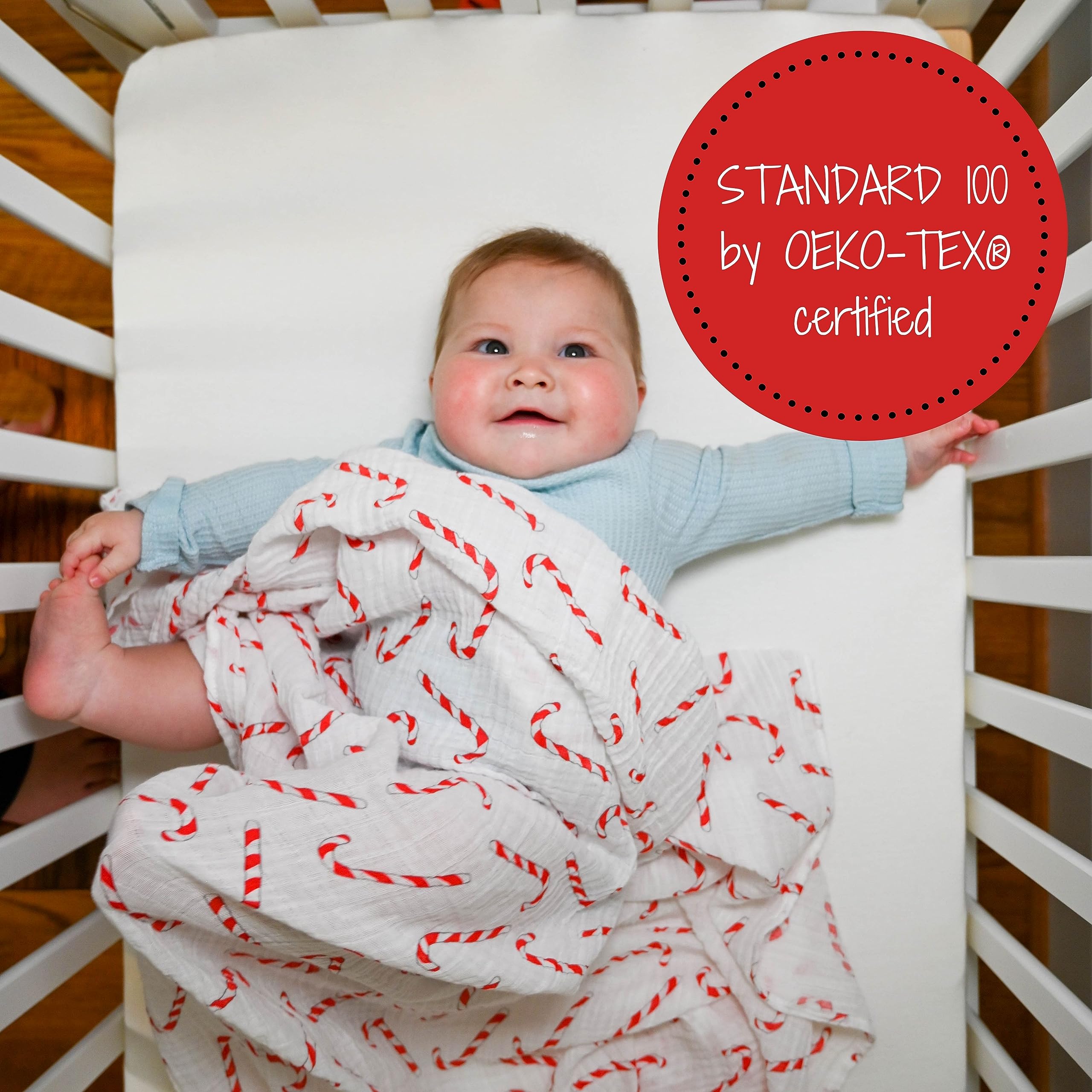 LollyBanks candy cane swaddle in crib scene highlights festive nursery style and calm baby moments