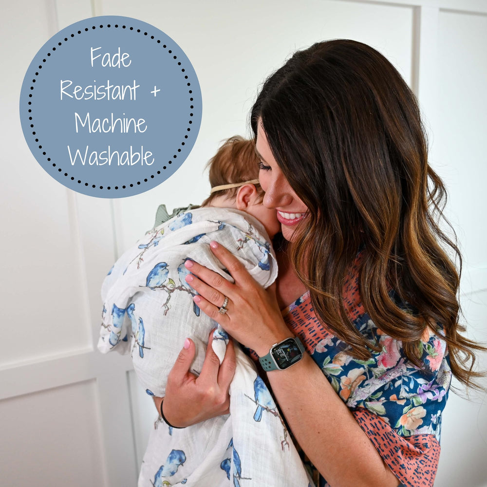 Diaper bag-friendly swaddle stays soft and easy to wash on the go.