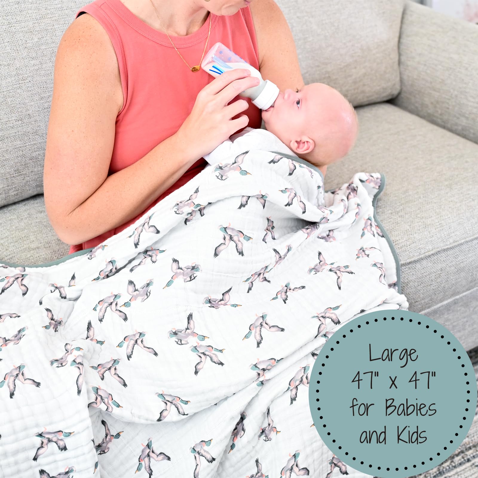 LollyBanks duck-print blanket folded in bag illustrates travel-friendly nursery essential.