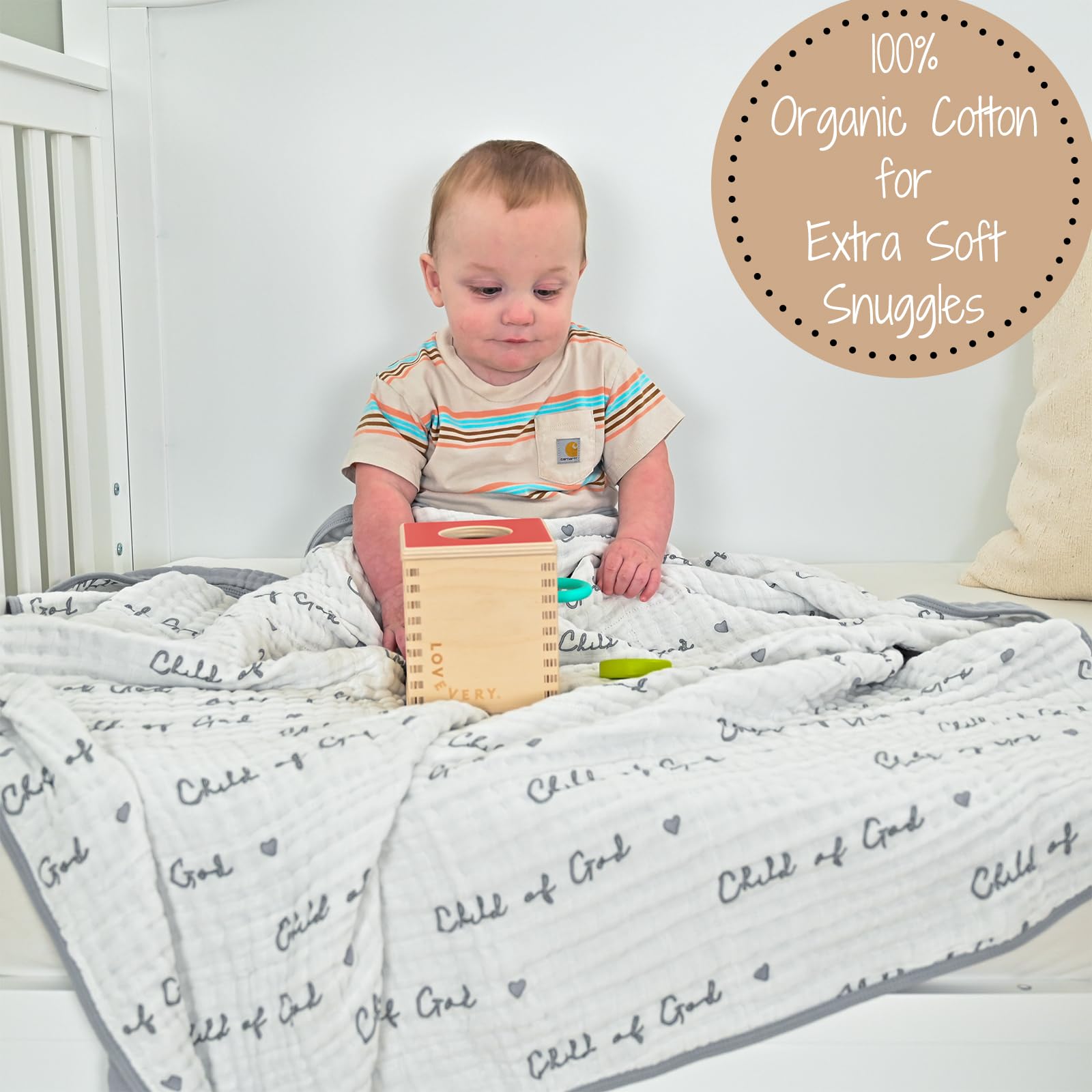 LollyBanks muslin blanket being held by toddler for cozy cuddles.