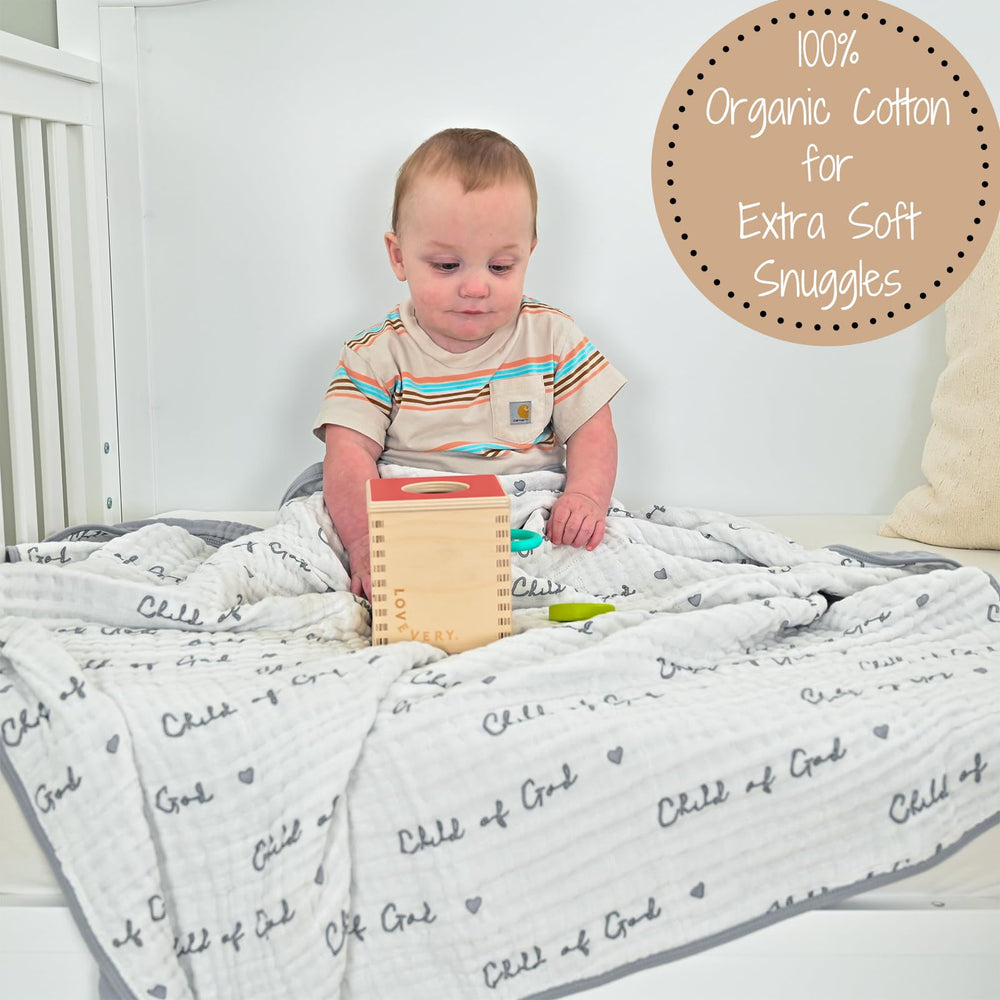 LollyBanks muslin blanket being held by toddler for cozy cuddles.