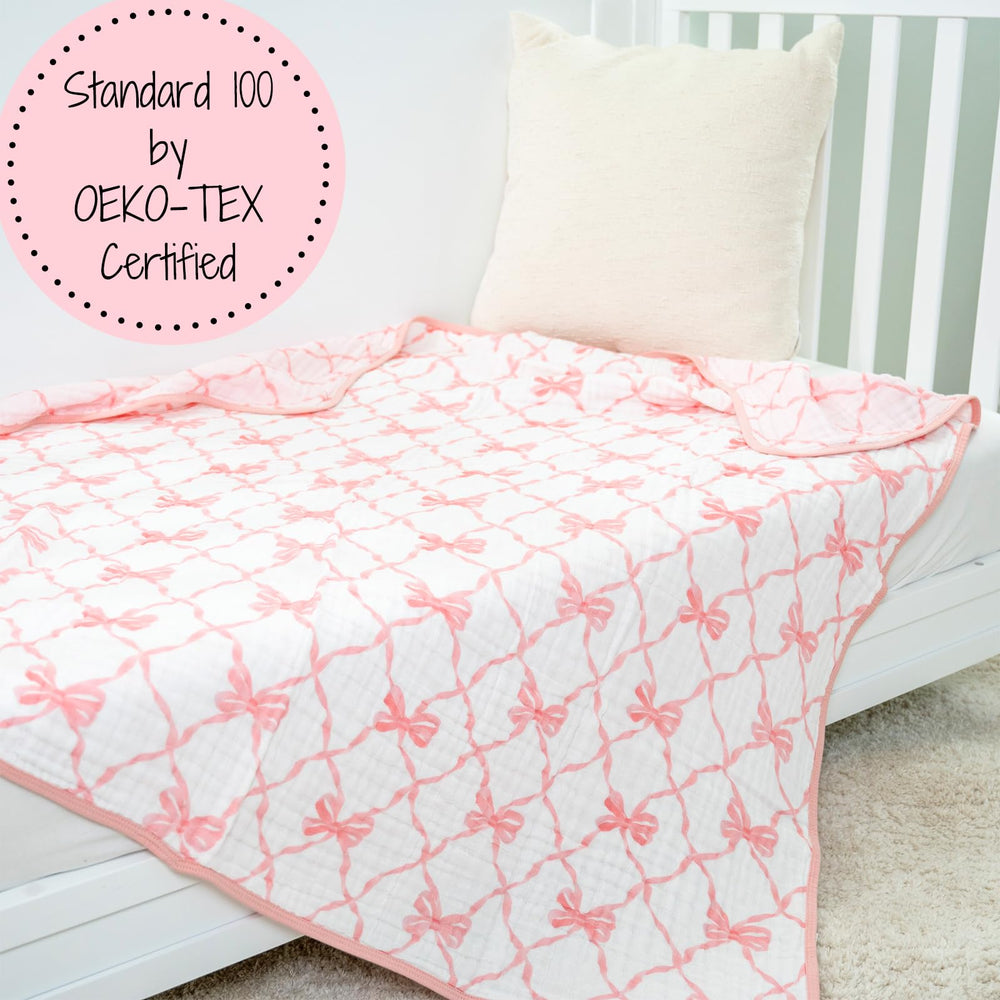 Nap time and travel use of the LollyBanks muslin blanket shown.