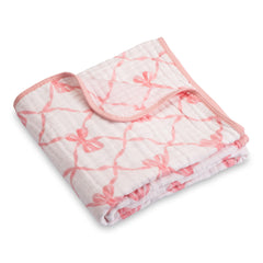 LollyBanks muslin blanket pink bow design provides gentle warmth for newborns.