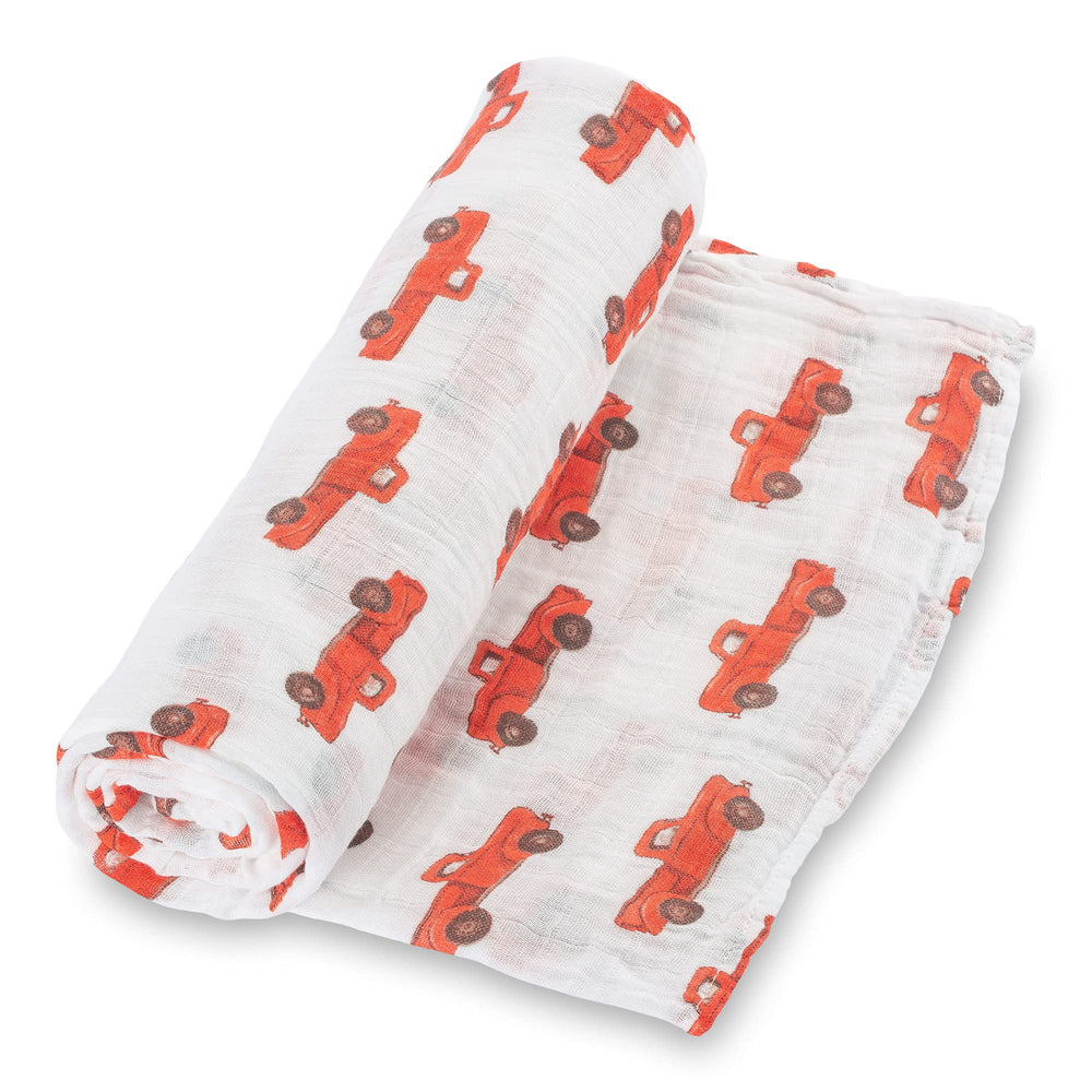 LollyBanks Muslin Swaddle Blanket with truck print design adds playful nursery charm and comfort.
