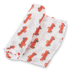 LollyBanks Muslin Swaddle Blanket with truck print design adds playful nursery charm and comfort.
