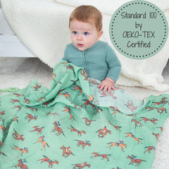 LollyBanks 100% cotton muslin swaddle shows soft breathable fabric for naps.