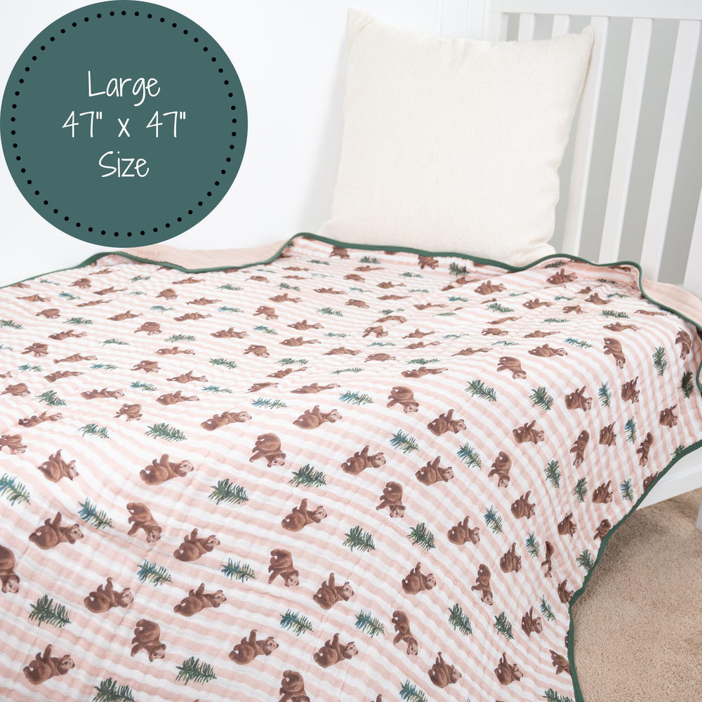 LollyBanks nursery bear-print blanket blends with crib decor while keeping baby comfy.