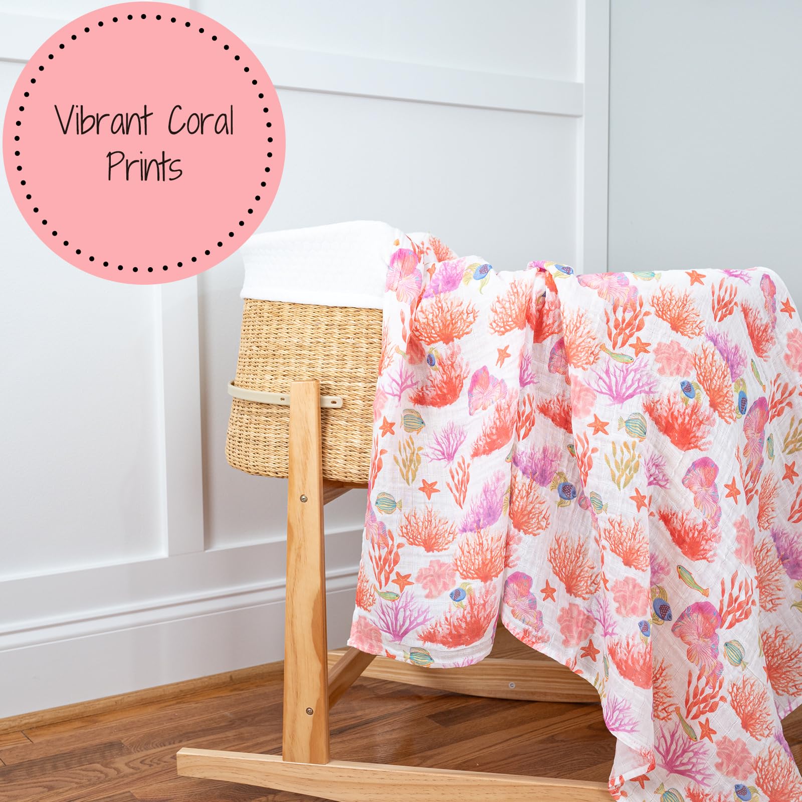 LollyBanks coral-print swaddle as nursery decor hanging on crib