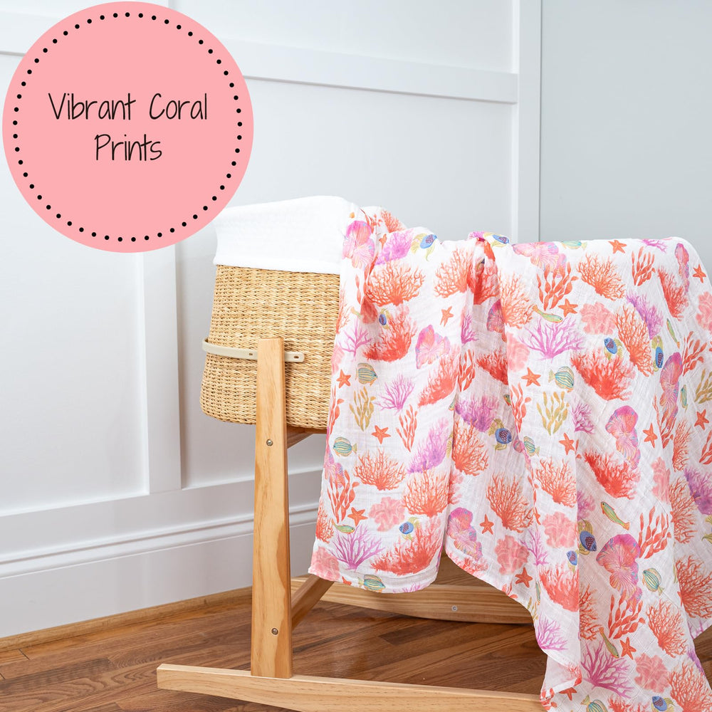 LollyBanks coral-print swaddle as nursery decor hanging on crib