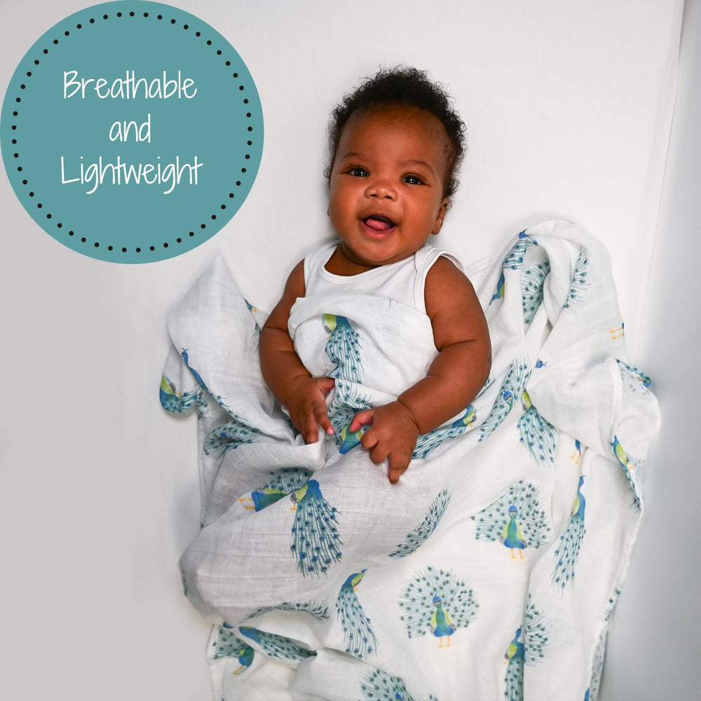 Peacock print blanket from LollyBanks breathes gently for newborn comfort.