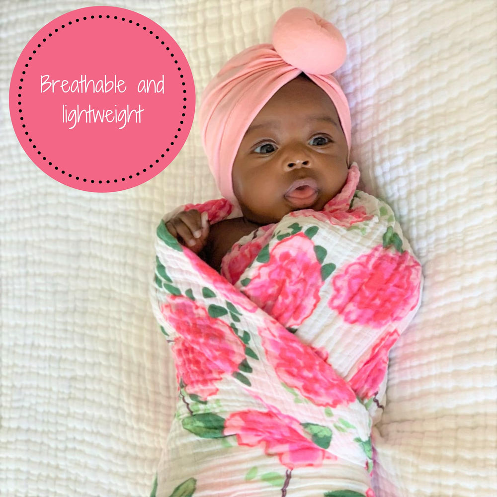 LollyBanks swaddle close-up, 100% cotton muslin highlights light breathable texture.