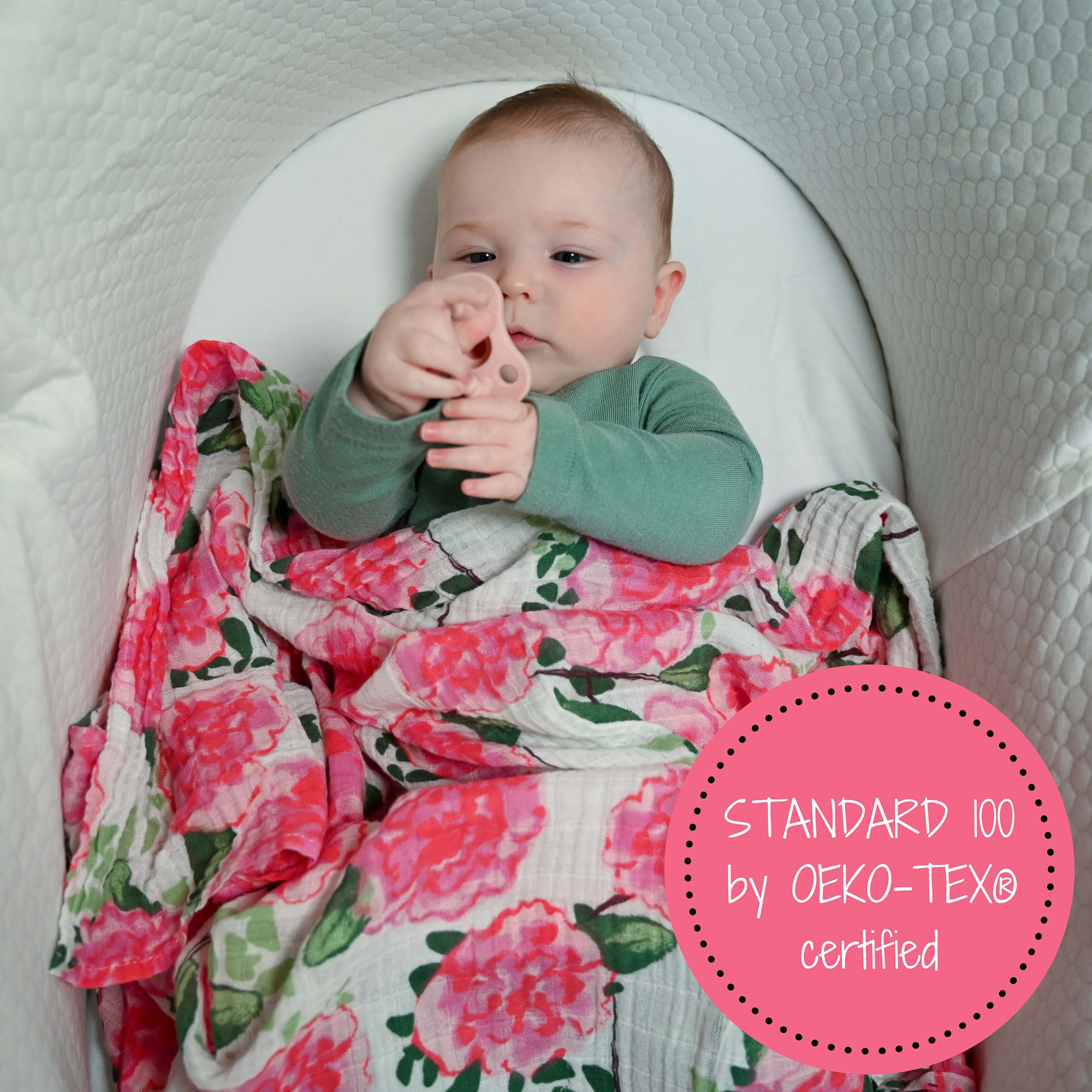 Peony print blanket hanging in nursery, adds decorative soft ambience.