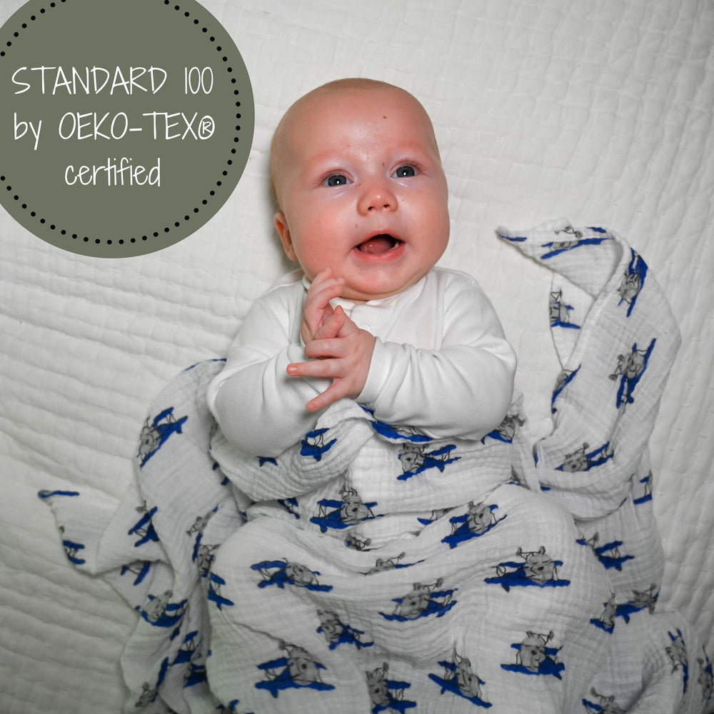 LollyBanks soft cotton muslin swaddle, gentle fabric for cozy snuggles.