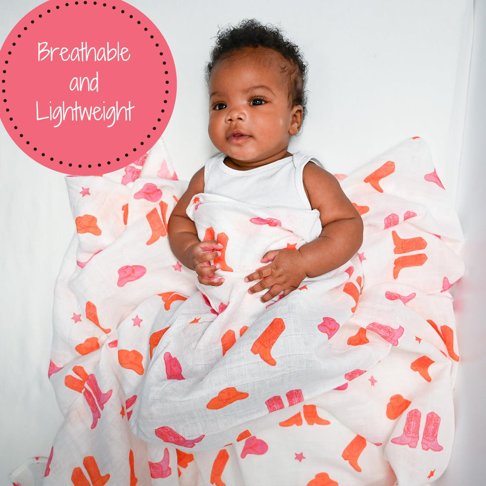 LollyBanks swaddle blanket laid out flat showing the 47x47 inch size in pink boot print.