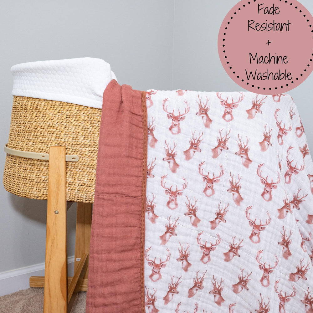 LollyBanks deer head blanket in a nursery adds cozy ambience for photos