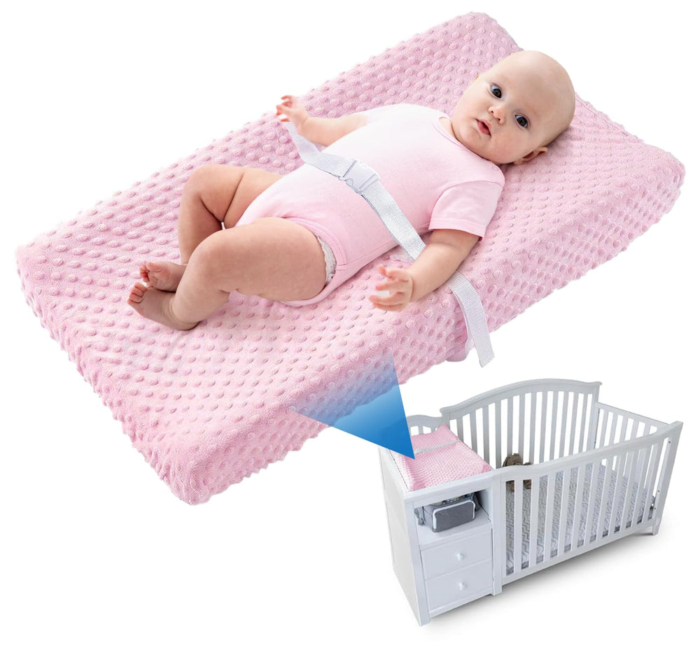 Loonah compact changing pad with pink cover for a clean, cozy diaper change.