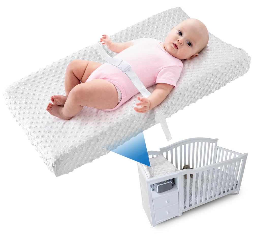 Loonah compact changing pad main image: secure, contoured 27x16 surface for cribs.