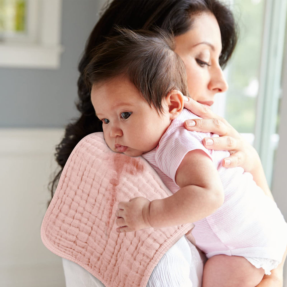 Looxii six-layer absorbent muslin burp cloth for quick mess absorption.